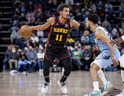 Nov 26, 2021; Memphis, Tennessee, USA; Atlanta Hawks guard Trae Young (11) works around Memphis Grizzlies guard Tyus Jones (21) in the first half at FedExForum. Mandatory Credit: Vasha Hunt-USA TODAY Sports