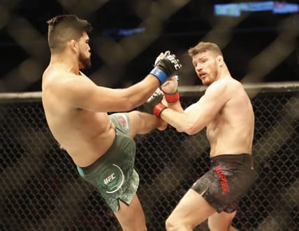 Nov 25, 2017; Shanghai, China; Kelvin Gastelum (blue gloves) fights Michael Bisping (red gloves) during UFC Fight Night at Mercedes-Benz Arena. Mandatory Credit: David G. McIntyre-USA TODAY Sports