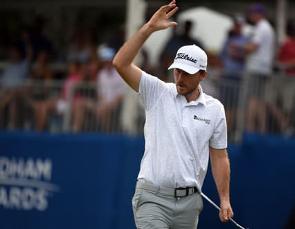 Aug 14, 2021; Greensboro, North Carolina, USA; Russell Henley reacts after making eagle on the 15th hole during the third round of the Wyndham Championship golf tournament. Mandatory Credit: Rob Kinnan-USA TODAY Sports