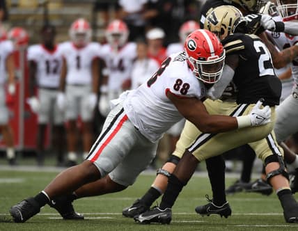 Sep 25, 2021; Nashville, Tennessee, USA; Georgia Bulldogs defensive lineman Jalen Carter (88) tackles Vanderbilt Commodores running back Rocko Griffin (24) for a loss during the first half at Vanderbilt Stadium. Mandatory Credit: Christopher Hanewinckel-USA TODAY Sports