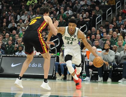 Mar 9, 2022; Milwaukee, Wisconsin, USA;  Milwaukee Bucks forward Giannis Antetokounmpo (34) drives to the basket against Atlanta Hawks forward Danilo Gallinari (8) in the first half at Fiserv Forum. Mandatory Credit: Michael McLoone-USA TODAY Sports