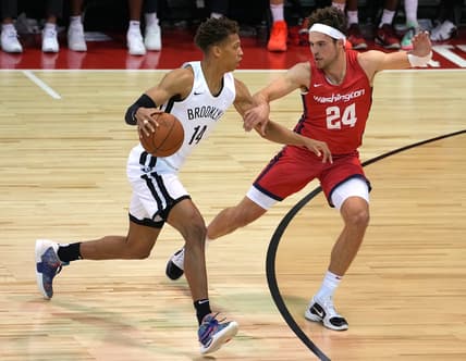 Aug 12, 2021; Las Vegas, Nevada, USA; Brooklyn Nets forward Kessler Edwards (14) dribbles the ball against Washington Wizards forward Corey Kispert (24) during an NBA Summer League game at Cox Pavillion. Mandatory Credit: Stephen R. Sylvanie-USA TODAY Sports