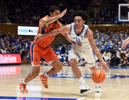 Nov 17, 2023; Durham, North Carolina, USA; Duke Blue Devils guard Jared McCain (0) drives to the basket as Bucknell Bison guard Brandon McCreesh (10) defends during the second half at Cameron Indoor Stadium. Mandatory Credit: Rob Kinnan-USA TODAY Sports