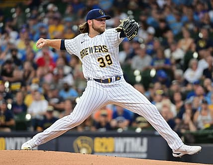 Aug 7, 2022; Milwaukee, Wisconsin, USA;  Milwaukee Brewers pitcher Corbin Burnes (39) throws a pitch in the first inning against the Cincinnati Reds at American Family Field. Mandatory Credit: Benny Sieu-USA TODAY Sports