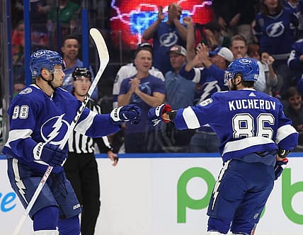 Dec 4, 2023; Tampa, Florida, USA; Tampa Bay Lightning right wing Nikita Kucherov (86) celebrates with  defenseman Mikhail Sergachev (98) after he scores a goal against the Dallas Stars during the first period at Amalie Arena. Mandatory Credit: Kim Klement Neitzel-USA TODAY Sports