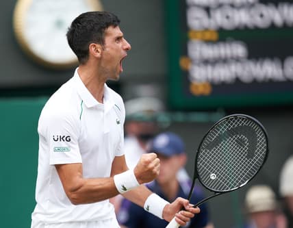 Jul 9, 2021; London, United Kingdom; Novak Djokovic (SRB) celebrates winning his men   s semi final against Denis Shapovalov (CAN) at All England Lawn Tennis and Croquet Club. Mandatory Credit: Peter van den Berg-USA TODAY Sports