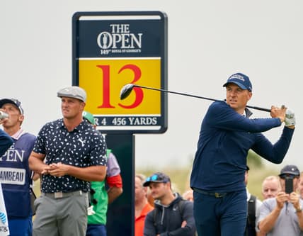 Jul 15, 2021; Sandwich, England, GBR; Jordan Spieth plays his shot at the thirteenth tee during the first round of the Open Championship golf tournament. Mandatory Credit: Peter van den Berg-USA TODAY Sports