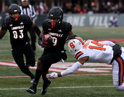 Louisville's Tyler Harrell makes Syracuse's Jason Simmons miss the tackle after he catches the ball and then runs for a touchdown. Nov. 13, 2021 Louisville Syracuse 18