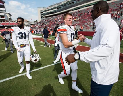 Auburn quarterback Bo Nix (10) shakes hands with Auburn athletics director Allen Greene at Donald W. Reynolds Razorback Stadium in Fayetteville, Ark., on Saturday, Oct. 19, 2019. Auburn defeated Arkansas 51-10.

Jc Auburnark 63