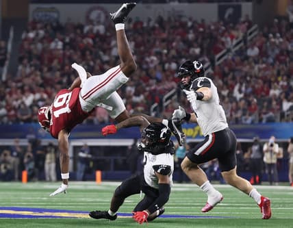 Dec 31, 2021; Arlington, Texas, USA; Alabama Crimson Tide receiver Jahleel Billingsley (19) is upended after a reception in the first quarter by Cincinnati Bearcats safety Ja'Von HIcks (3) during the 2021 Cotton Bowl college football CFP national semifinal game at AT&T Stadium. Mandatory Credit: Matthew Emmons-USA TODAY Sports