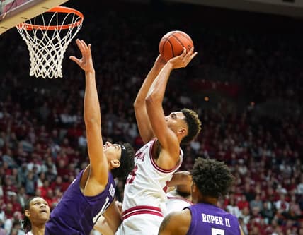 Jan 8, 2023; Bloomington, Indiana, USA;  Indiana Hoosiers forward Trayce Jackson-Davis (23) scores over Northwestern Wildcats forward Tydus Verhoeven (10) during the first half at Simon Skjodt Assembly Hall. Mandatory Credit: Robert Goddin-USA TODAY Sports