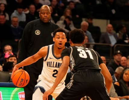 Mar 8, 2023; New York, NY, USA;  Villanova Wildcats guard Mark Armstrong (2) drives against Georgetown Hoyas guard Wayne Bristol Jr. (31) as Georgetown Hoyas head coach Patrick Ewing watches at rear at Madison Square Garden. Mandatory Credit: Robert Deutsch-USA TODAY Sports