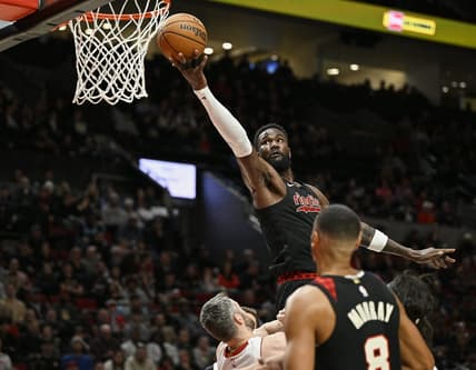 Feb 27, 2024; Portland, Oregon, USA; Portland Trail Blazers center Deandre Ayton (2) scores a basket during the first half against Miami Heat forward Kevin Love (42) at Moda Center. Mandatory Credit: Troy Wayrynen-USA TODAY Sports