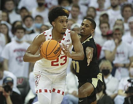 Mar 1, 2022; Madison, Wisconsin, USA; Wisconsin Badgers guard Chucky Hepburn (23) looks to pass as Purdue Boilermakers guard Isaiah Thompson (11) defends at the Kohl Center. Mandatory Credit: Mary Langenfeld-USA TODAY Sports