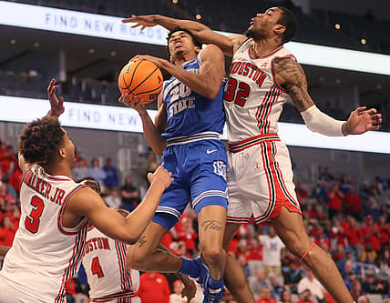 Memphis Tigers forward Josh Minott (20) is fouled by Houston Cougars forward Reggie Chaney (32) during their AAC Tournament Championship at Dickies Arena in Fort Worth, TX on Sunday, March 13, 2022.

Jrca9188