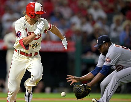 Sep 3, 2022; Anaheim, California, USA;  Houston Astros relief pitcher Hector Neris (50) fields ball hit by Los Angeles Angels outfielder Ryan Aguilar (39) before throwing to retire Aguilar at first base in the 11th inning at Angel Stadium. Mandatory Credit: Jayne Kamin-Oncea-USA TODAY Sports