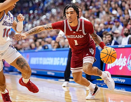 Dec 17, 2022; Lawrence, Kansas, USA; Indiana Hoosiers guard Jalen Hood-Schifino (1) drives against Kansas Jayhawks forward Jalen Wilson (10) during the first half at Allen Fieldhouse. Mandatory Credit: Jay Biggerstaff-USA TODAY Sports