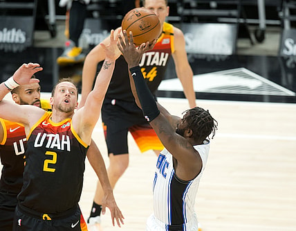 Apr 3, 2021; Salt Lake City, Utah, USA; Orlando Magic forward James Ennis III (right) shoots the ball against Utah Jazz forward Joe Ingles (2) during the first quarter at Vivint Smart Home Arena. Mandatory Credit: Russell Isabella-USA TODAY Sports