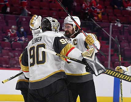 Jun 20, 2021; Montreal, Quebec, CAN; Vegas Golden Knights goalie Robin Lehner (90) and forward Mark Stone (61) celebrate the win against the Montreal Canadiens in game four of the 2021 Stanley Cup Semifinals at the Bell Centre. Mandatory Credit: Eric Bolte-USA TODAY Sports