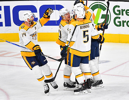 Jan 4, 2022; Las Vegas, Nevada, USA; Nashville Predators players celebrate a goal scored by Nashville Predators left wing Filip Forsberg (9) during the third period against the Vegas Golden Knights at T-Mobile Arena. Mandatory Credit: Stephen R. Sylvanie-USA TODAY Sports