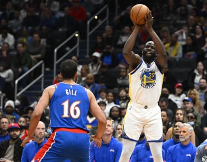 Mar 27, 2022; Washington, District of Columbia, USA; Golden State Warriors forward Draymond Green (23) shoots over Washington Wizards forward Anthony Gill (16) during the first half at Capital One Arena. Mandatory Credit: Brad Mills-USA TODAY Sports