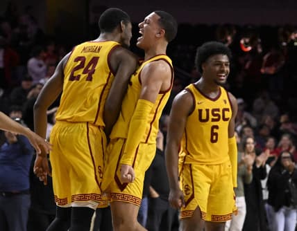 Feb 15, 2024; Los Angeles, California, USA; Southern California Trojans guard Kobe Johnson (center) celebrates with forward Joshua Morgan (24) and guard Bronny James (6) after the Trojans defeat the Utah Utes in a NCAA basketball game at Galen Center. Mandatory Credit: Alex Gallardo-USA TODAY Sports