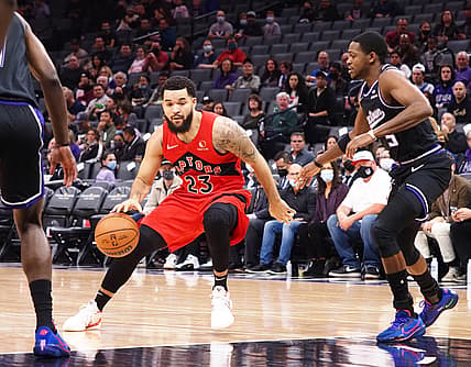 Nov 19, 2021; Sacramento, California, USA;  Toronto Raptors guard Fred VanVleet (23) controls the ball against Sacramento Kings guard De'Aaron Fox (5) during the first quarter at Golden 1 Center. Mandatory Credit: Kelley L Cox-USA TODAY Sports