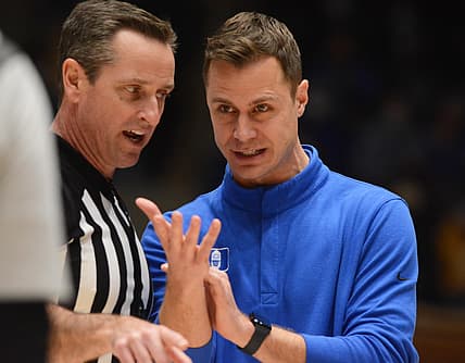 Feb 15, 2022; Durham, North Carolina, USA; Duke Blue Devils associate head coach Jon Scheyer (right) talks with and official during the second half at Cameron Indoor Stadium.  The Blue Devils won 76-74. Mandatory Credit: Rob Kinnan-USA TODAY Sports