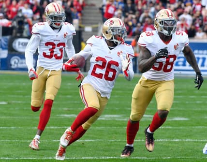 Dec 24, 2016; Los Angeles, CA, USA; San Francisco 49ers cornerback Tramaine Brock (center) runs upfield with a first quarter interception followed by cornerback Rashard Robinson (33) and outside linebacker Eli Harold (58) on a pass intended for Los Angeles Rams wide receiver Tavon Austin (not pictured) at Los Angeles Memorial Coliseum. Mandatory Credit: Robert Hanashiro-USA TODAY Sports