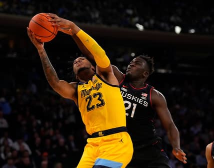 Mar 10, 2023; New York, NY, USA;  Marquette Golden Eagles forward David Joplin (23) shoots against Connecticut Huskies forward Adama Sanogo (21) in the first half at Madison Square Garden. Mandatory Credit: Robert Deutsch-USA TODAY Sports