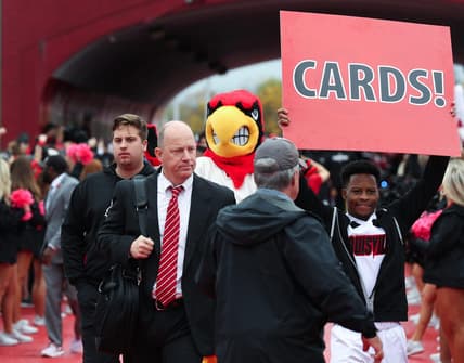 U of L head football coach Jeff Brohm enters the stadium during the Cards March ahead of their game against Duke at the L&N Stadium in Louisville, Ky. on Oct. 28, 2023.