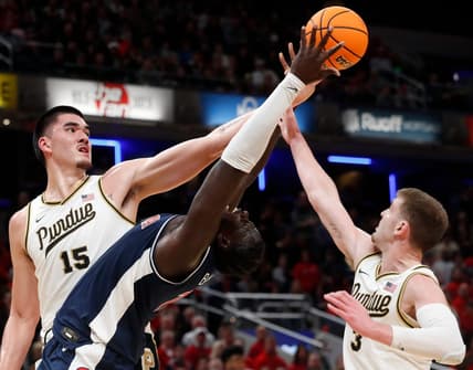 Purdue Boilermakers center Zach Edey (15), Arizona Wildcats center Oumar Ballo (11) and Purdue Boilermakers guard Braden Smith (3) fight for a rebound during the NCAA men   s basketball game, Saturday, Dec. 16, 2023, at Gainbridge Fieldhouse in Indianapolis. Purdue Boilermakers won 92-84.