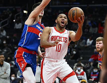 Jan 5, 2022; Washington, District of Columbia, USA; Houston Rockets guard Eric Gordon (10) shoots as Washington Wizards forward Deni Avdija (9) defends during the first half at Capital One Arena. Mandatory Credit: Brad Mills-USA TODAY Sports