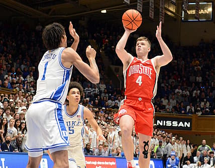 Nov 30, 2022; Durham, North Carolina, USA; Ohio State Buckeyes guard Sean McNeil (4) shooots over Duke Blue Devils center Dereck Lively (1) during the first half at Cameron Indoor Stadium. Mandatory Credit: Rob Kinnan-USA TODAY Sports