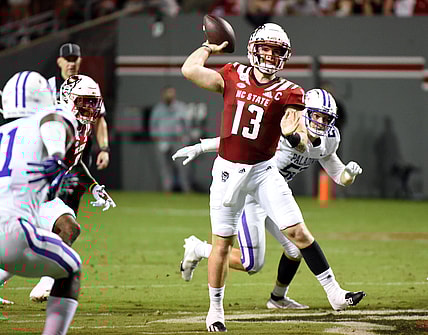 Sep 18, 2021; Raleigh, North Carolina, USA; North Carolina State Wolfpack quarterback Devin Leary (13) throws a pass during the first half against the Furman Paladins at Carter-Finley Stadium. Mandatory Credit: Rob Kinnan-USA TODAY Sports