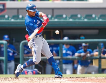 Mar 15, 2021; Lakeland, Florida, USA;  Toronto Blue Jays shortstop Santiago Espinal (5) singles in the 6th inning during spring training at Publix Field at Joker Marchant Stadium. Mandatory Credit: Nathan Ray Seebeck-USA TODAY Sports