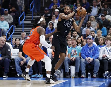 Mar 14, 2023; Oklahoma City, Oklahoma, USA; Brooklyn Nets forward Mikal Bridges (1) is defended by Oklahoma City Thunder guard Luguentz Dort (5) during the second quarter at Paycom Center. Mandatory Credit: Alonzo Adams-USA TODAY Sports