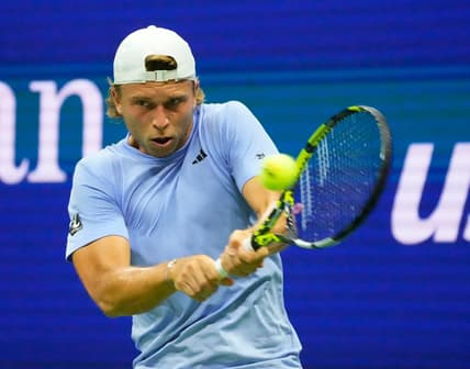 Aug 28, 2023; Flushing, NY, USA;  Alexandre Muller of France hits to Novak Djokovic of Serbia on day one of the 2023 U.S. Open tennis tournament at USTA Billie Jean King National Tennis Center.Mandatory Credit: Robert Deutsch-USA TODAY Sports