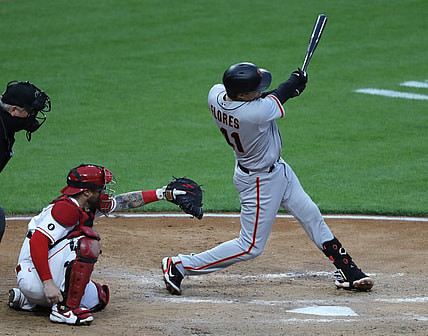 May 17, 2021; Cincinnati, Ohio, USA; San Francisco Giants second baseman Wilmer Flores (41) hits a single against the Cincinnati Reds during the sixth inning at Great American Ball Park. Mandatory Credit: David Kohl-USA TODAY Sports