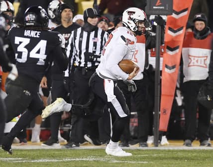 Nov. 19, 2022; Ames, Iowa, USA;  [CAPTION] Texas Tech Red Raiders quarterback Tyler Shough (12) runs with the ball for a first down around Iowa State Cyclones linebacker O'Rien Vance (34) during the second quarter in the senior day Big-12 showdown at Jack Trice Stadium. Mandatory Credit: Nirmalendu Majumdar/Ames Tribune-USA TODAY Network

Ncaa Football Texas Tech At Iowa State