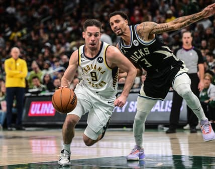 Jan 16, 2023; Milwaukee, Wisconsin, USA; Indiana Pacers guard T.J. McConnell (9) drives for the basket against Milwaukee Bucks guard George Hill (3) in the third quarter at Fiserv Forum. Mandatory Credit: Benny Sieu-USA TODAY Sports