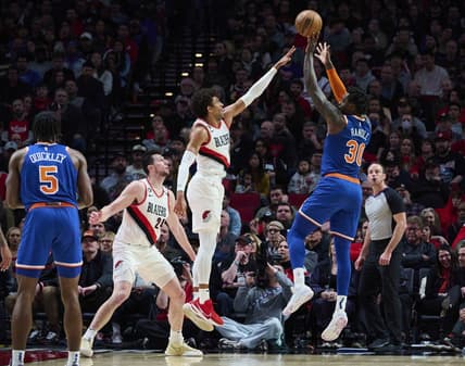 Mar 14, 2023; Portland, Oregon, USA; New York Knicks forward Julius Randle (30) shoots a jump shot during the first half against Portland Trail Blazers guard Matisse Thybulle (4) at Moda Center. Mandatory Credit: Troy Wayrynen-USA TODAY Sports