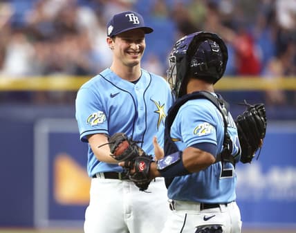Apr 8, 2023; St. Petersburg, Florida, USA; Tampa Bay Rays relief pitcher Kevin Kelly (49) and catcher Francisco Mejia (21) celebrate after they defeated the Oakland Athletics at Tropicana Field. Mandatory Credit: Kim Klement-USA TODAY Sports