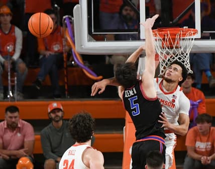 Sunday, November 19, 2023; Pickens County, SC; Clemson senior guard Chase Hunter (1) blocks the shot of Boise State guard RJ Keene (5) during the second half at Littlejohn Coliseum. Mandatory Credit: Ken Ruinard-USA TODAY NETWORK