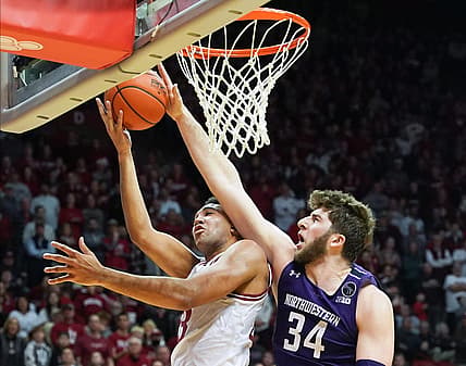 Jan 8, 2023; Bloomington, Indiana, USA;  Northwestern Wildcats center Matthew Nicholson (34) blocks the shot attempt from Indiana Hoosiers forward Trayce Jackson-Davis (23) during the first half at Simon Skjodt Assembly Hall. Mandatory Credit: Robert Goddin-USA TODAY Sports