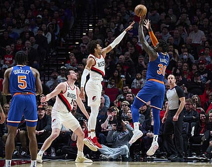 Mar 14, 2023; Portland, Oregon, USA; New York Knicks forward Julius Randle (30) shoots a jump shot during the first half against Portland Trail Blazers guard Matisse Thybulle (4) at Moda Center. Mandatory Credit: Troy Wayrynen-USA TODAY Sports
