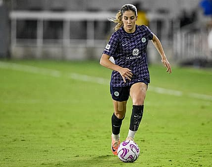 Aug 19, 2023; Louisville, Kentucky, USA; Racing Louisville FC midfielder Savannah DeMelo (7) dribbles the ball during the second half at Lynn Family Stadium. Mandatory Credit: Jamie Rhodes-USA TODAY Sports