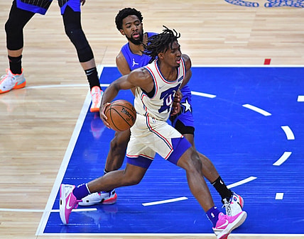 May 16, 2021; Philadelphia, Pennsylvania, USA; Philadelphia 76ers guard Tyrese Maxey (0) drives past Orlando Magic guard Chasson Randle (25) during the first quarter at Wells Fargo Center. Mandatory Credit: Eric Hartline-USA TODAY Sports