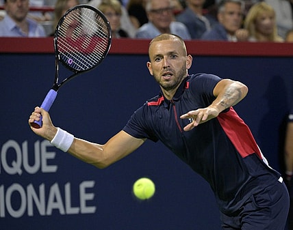 Aug 13, 2022; Montreal, QC, Canada; Daniel Evans (GBR) hits a forehand against Pablo Carreno Busta (ESP) (not pictured) in semifinal play in the National Bank Open at IGA Stadium. Mandatory Credit: Eric Bolte-USA TODAY Sports