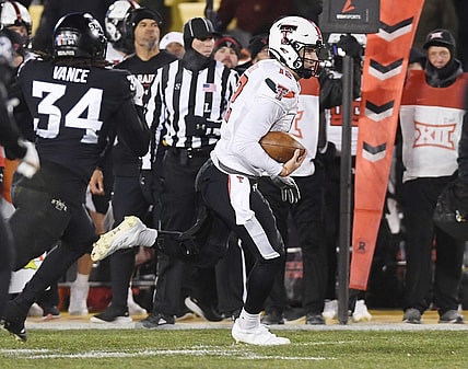 Nov. 19, 2022; Ames, Iowa, USA;  [CAPTION] Texas Tech Red Raiders quarterback Tyler Shough (12) runs with the ball for a first down around Iowa State Cyclones linebacker O'Rien Vance (34) during the second quarter in the senior day Big-12 showdown at Jack Trice Stadium. Mandatory Credit: Nirmalendu Majumdar/Ames Tribune-USA TODAY Network

Ncaa Football Texas Tech At Iowa State